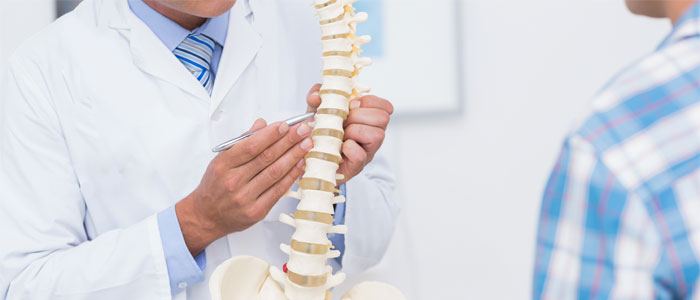 chiropractor discussing herniated discs with patient